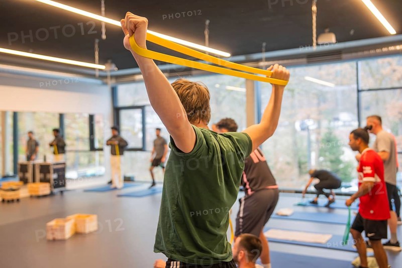 Several people train collectively with bands in the modern training room, Fitness TSV Calw, Germany
