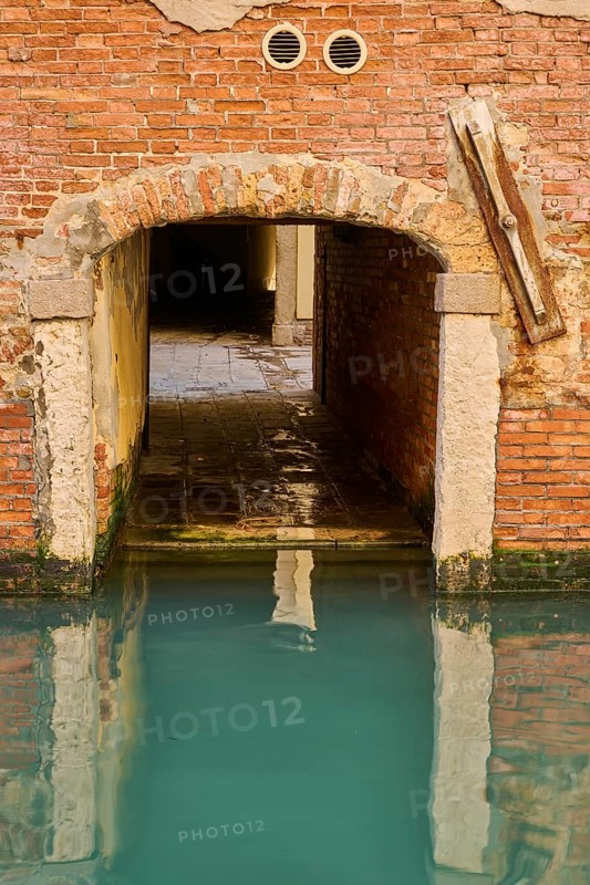 Entrance from the water way View from the waterway in the water in Venice on a sunny day in winter, Italy