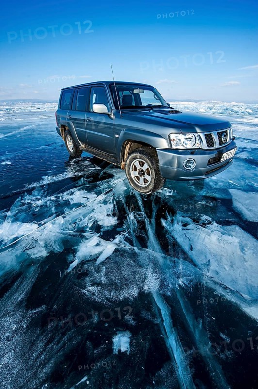Car on ice, Lake Baikal, Olkhon Island, Pribaikalsky National Park, Irkutsk Province, Siberia, Russia