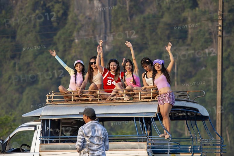 Photo shoot with young girls in the karst landscape near Vang Vieng, Vientiane province, Laos