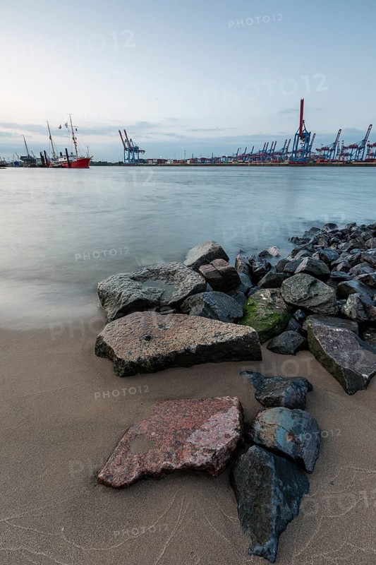 Elbe beach with container terminal and ships in the background in Hamburg