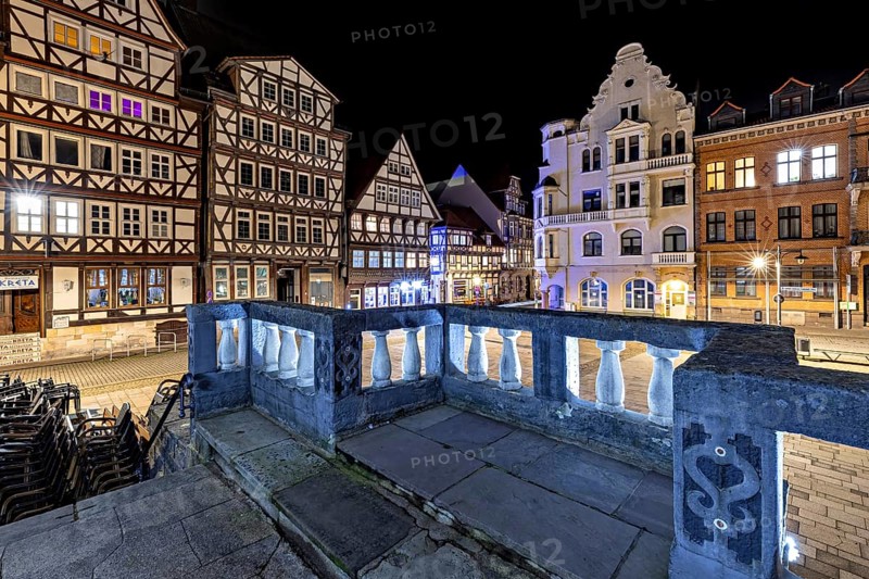 Night scene of a historic town with illuminated half-timbered houses and streets in a quiet atmosphere, The historic town hall of Hannoversch Münden in Lower Saxony