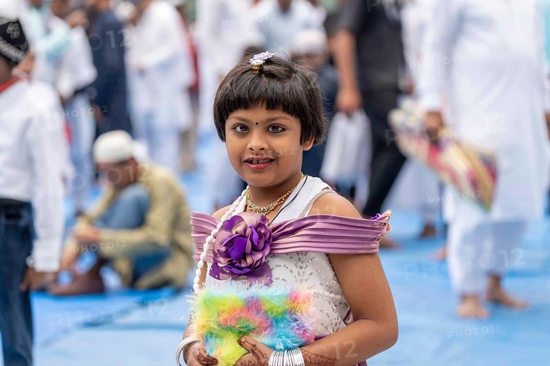 A Muslim girl child with elders attend to Eid al-Fitr prayer at Eidgah, on March 21, 2026 in Guwahati, India. Muslims make up a sizeable minority of India's population and celebrate Eid along with muslims across the world at the end of Ramadan
