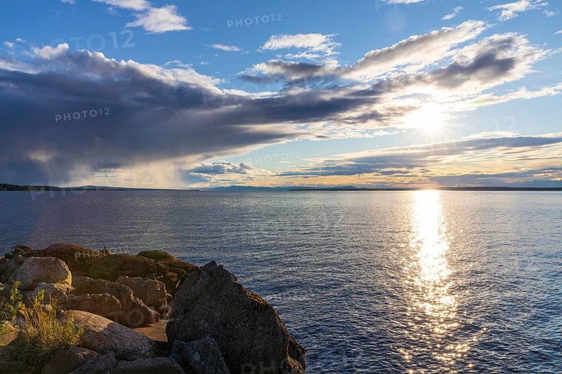 Evening with sun and clouds on Lake Siljan in Rättvik harbour, Dalarnas län, Sweden