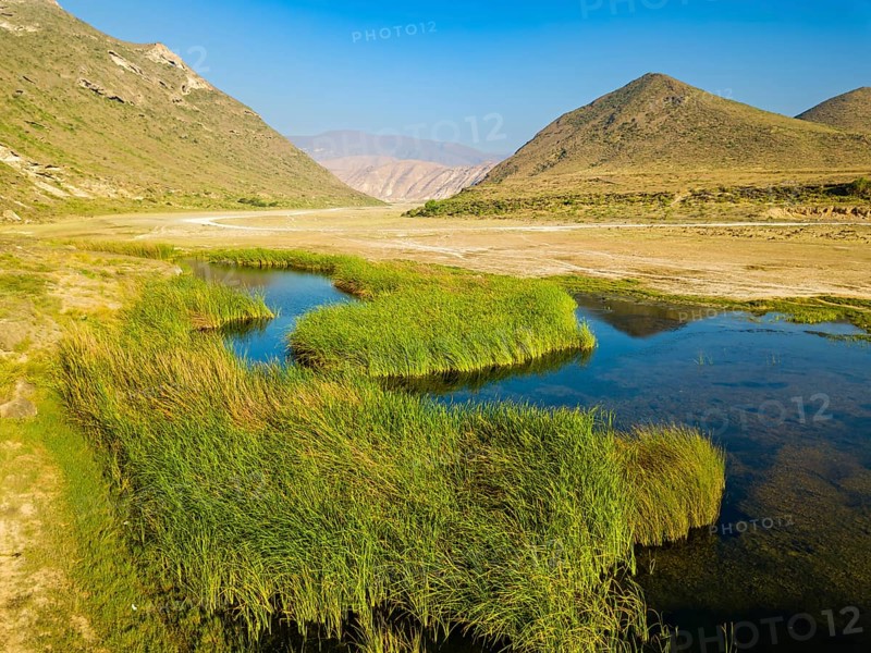 Landscape in Oman, mountains, Wadi Ashawq, road, reeds, waters Salalah, Al Mughsyal / Wadi Ashawq, Dhofar, Oman