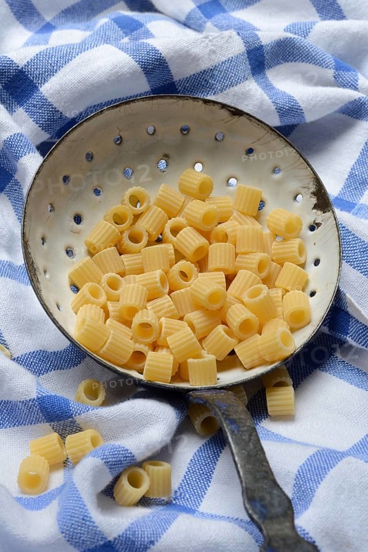 Tubetti rigati, Italian pasta variety, pasta in a ladle, Italy