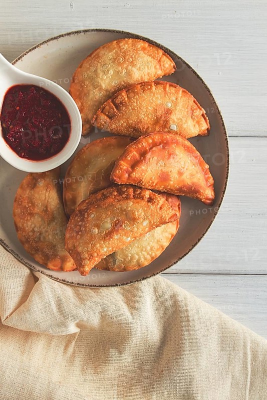 Fried chebureks, close-up, on a light background, no people