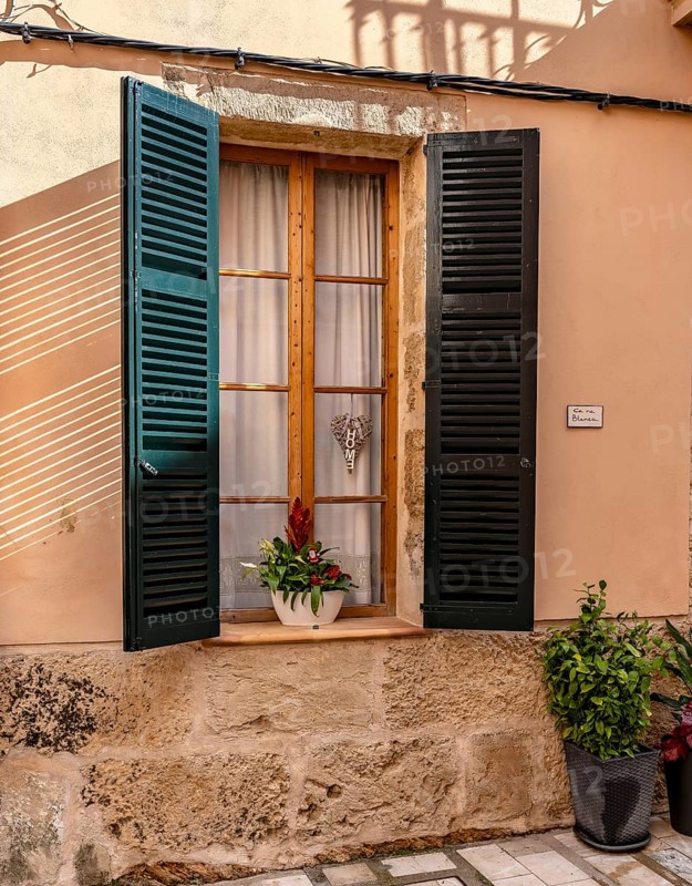 Detail photo, house facades of the historic houses in the old town of Alcudia, Majorca, Spain
