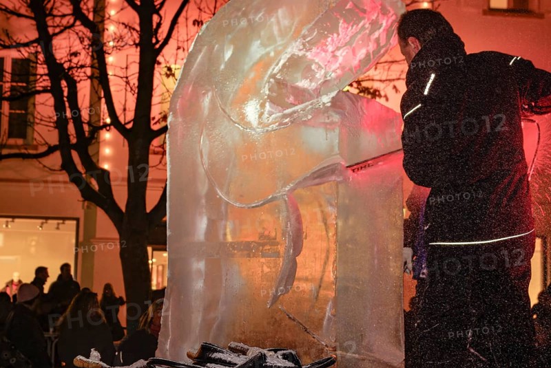 An ice sculpture is being created: ice carving street action as part of the long shopping night in the city center of Reutlingen, Baden-Württemberg, Germany, for editorial use only