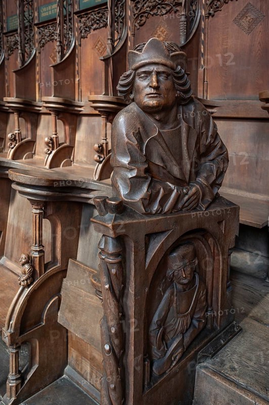 Figures on the late Gothic choir stalls from 1507, St Martin, Memmingen, Bavaria, Germany