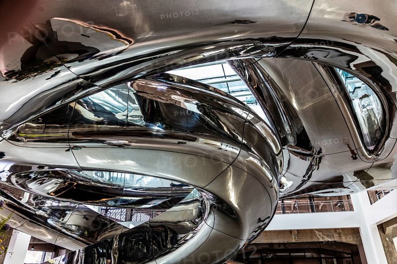 Spectacular double spiral staircase from ground floor to roof terrace, offering breathtaking views over the Maas and Hotel New York, FENIX, museum about migration, in a historic warehouse in Katendrecht, Rotterdam, the Netherlands