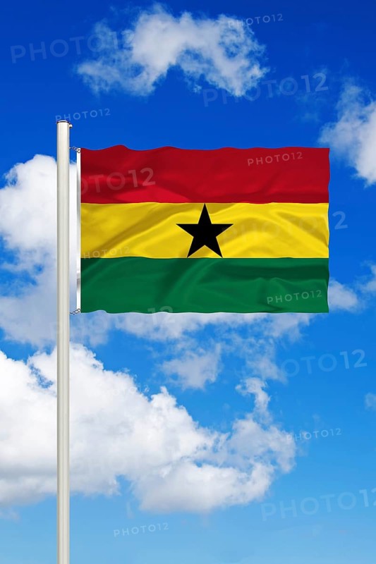 National flag of Ghana, West Africa, Cumulus clouds in front of blue sky, Studio