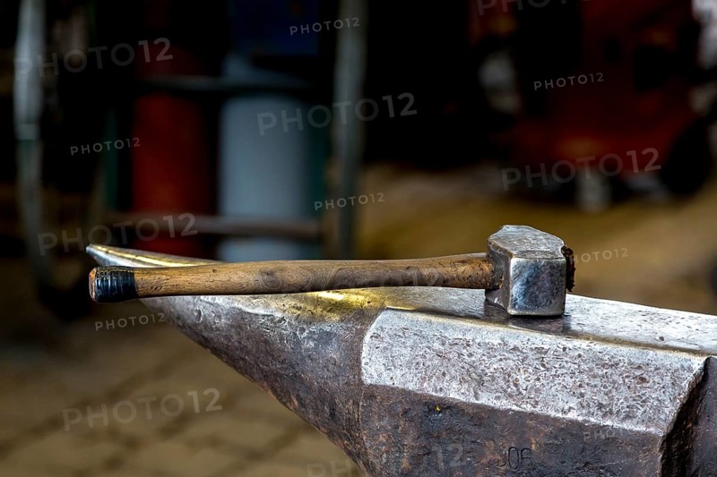 A blacksmith forging, working at the Ehnert forge in Dresden-Bühlau, Saxony, Germany