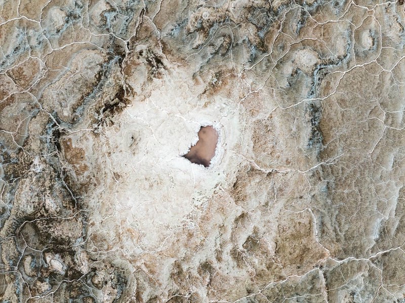 Abstract patterns of saline deposits at the salt works of Walvis Bay. Aerial view. Drone shot. Namibia