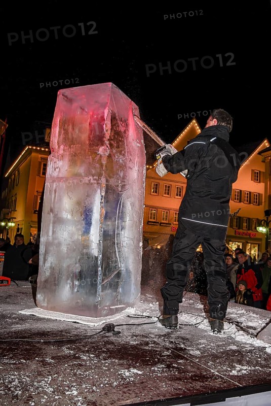 An ice sculpture is being created: ice carving street action as part of the long shopping night in the city center of Reutlingen, Baden-Württemberg, Germany, for editorial use only