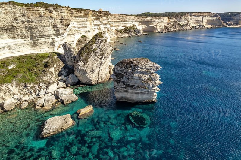 The white chalk cliffs of the cliffs near Bonifacio seen from the air, Corsica, France