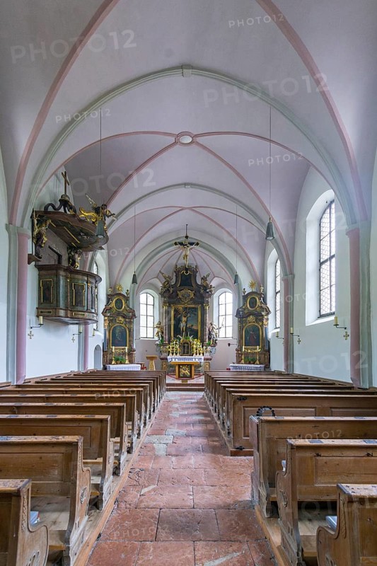 Parish church of St. Sebastian, interior with wooden benches and a central altar, high Gothic windows with stained glass, quiet and reverent atmosphere, Ramsau, Berchtesgadener Land, Bavaria, Germany