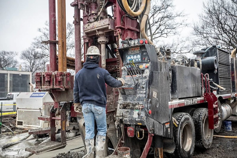 Detroit, Michigan - Workers for Crabtree Drilling drill a series of 500-foot deep wells for a geothermal system. The system will heat and cool a new commercial building housing a public market at the East Warren Development Corporation