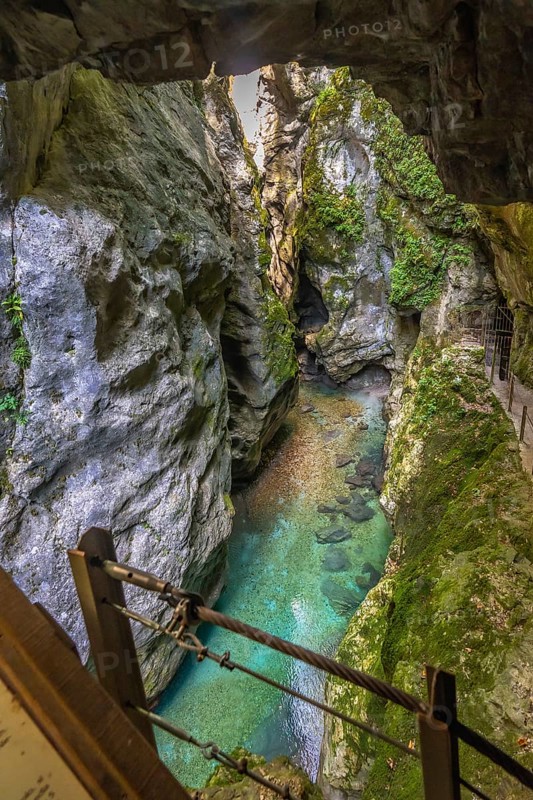 Breathtaking view of tolmin gorges with crystal clear emerald green water flowing through narrow canyon, creating a mesmerizing natural spectacle