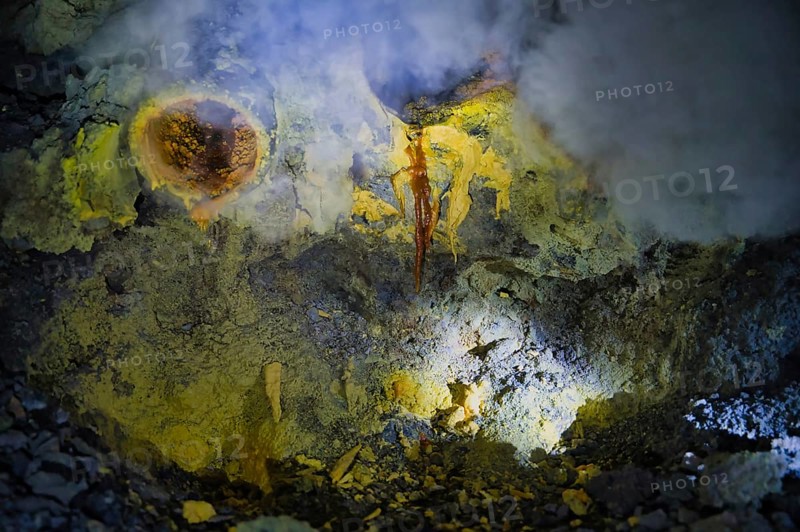 Sulfur deposits at Ijen Volcano, Indonesia, showcase vibrant hues from volcanic activity. This powerful natural phenomenon highlights earth's geothermal processes vividly