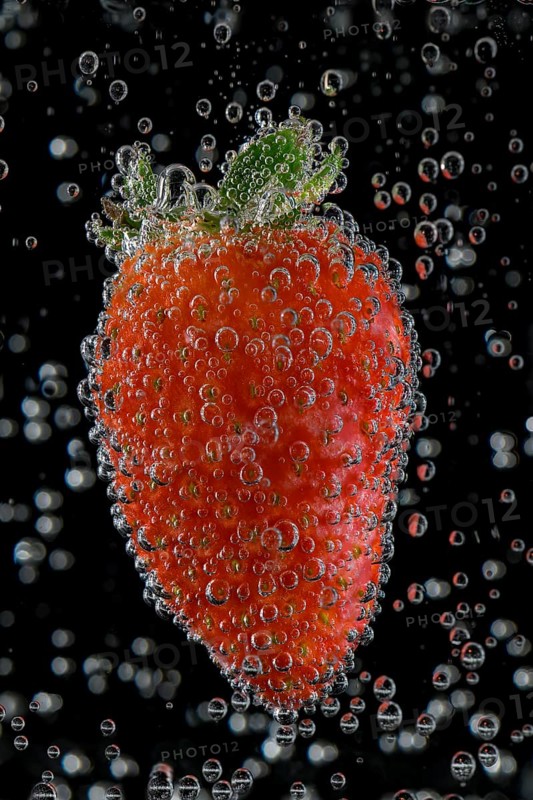 Strawberry with air bubbles in water, Germany