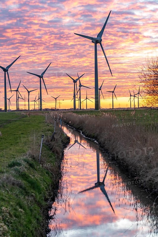 Wind farm near the East Frisian town of Norden, east of the town, sunset, Lower Saxony, Germany