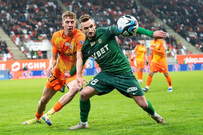 LUBIN, POLAND - DECEMBER 15, 2023: Football match Polish PKO Ekstraklasa between KGHM Zaglebie Lubin vs Slask Wroclaw 1:2. In action Bartlomiej Kludka (L) Michal Rzuchowski (R)