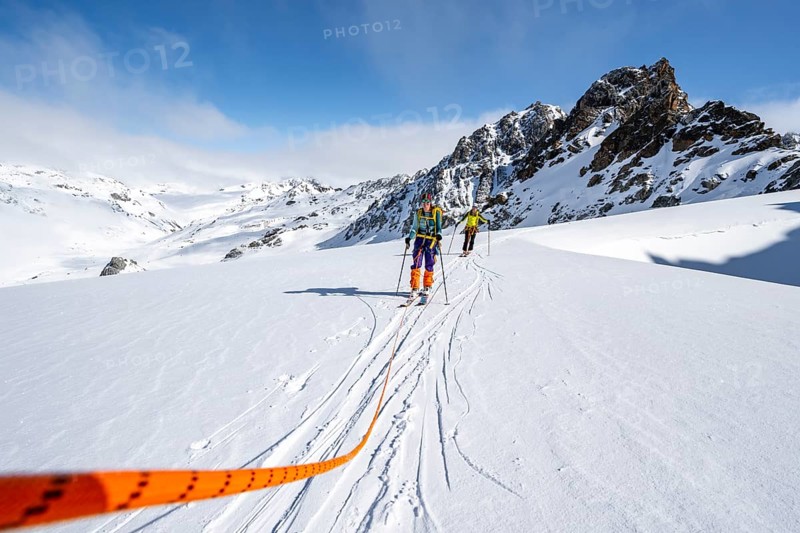 Ski tourer with rope, rope team on the Vadret da Porchabella glacier on the ascent to the summit of Piz Kesch, mountain landscape in winter, alpine tour, ski tour Bündner Haute Route, Albula Alps, Rhaetian Alps, Grisons, Eastern Switzerland, Switzerland