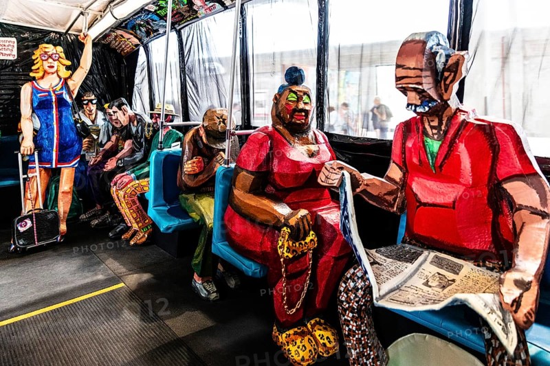 Sculpture The Bus by artist Red Grooms, depicting hectic city life with various passengers, FENIX, museum about migration, in a historic warehouse in Katendrecht, hub for overseas emigrants, Rotterdam, Netherlands