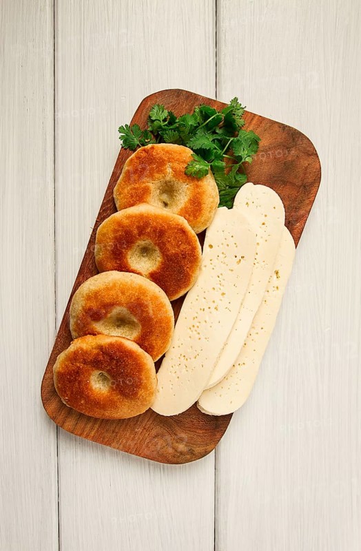 Mchadi, corn tortillas, traditional Georgian dish, corn bread, with Imeretian cheese, homemade, no people, on a light background