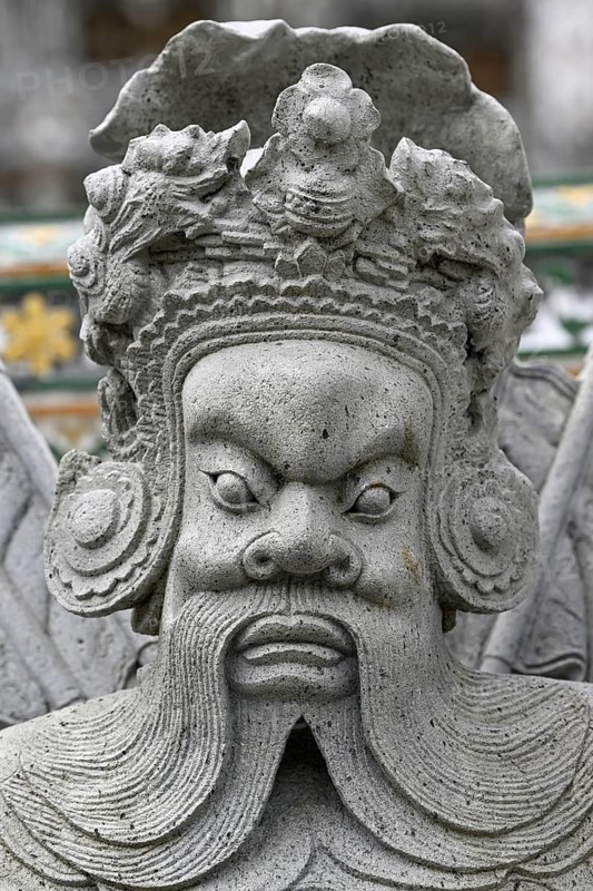 Stone statue of a Chinese warrior, guardian, Wat Arun, Temple of Dawn, Bangkok, Thailand