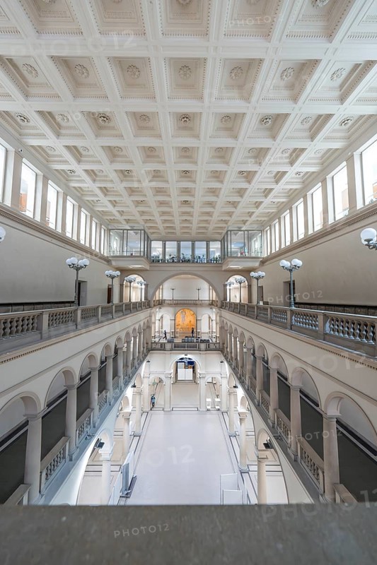 Light-flooded, symmetrical building interior with corridors and columns, Zurich, Switzerland