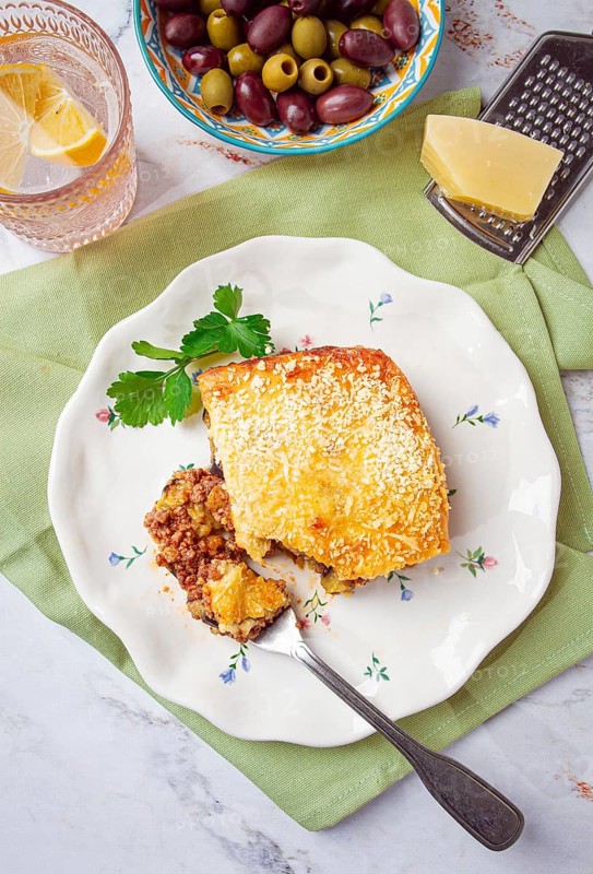 Sliced moussaka, Greek dish, baked eggplant with minced meat, with bechamel sauce, home cooking