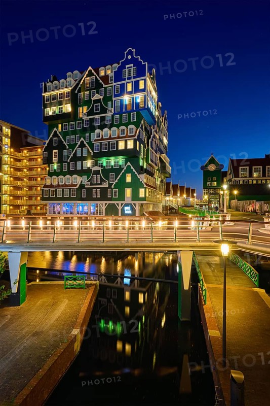 ZAANDAM, NETHERLANDS, MAY 8, 2017: Inntel Hotel in Zaandam illuminated at night. Design of 12-storey tall building opened in 2009 is the result of stacking a series of traditional Dutch houses