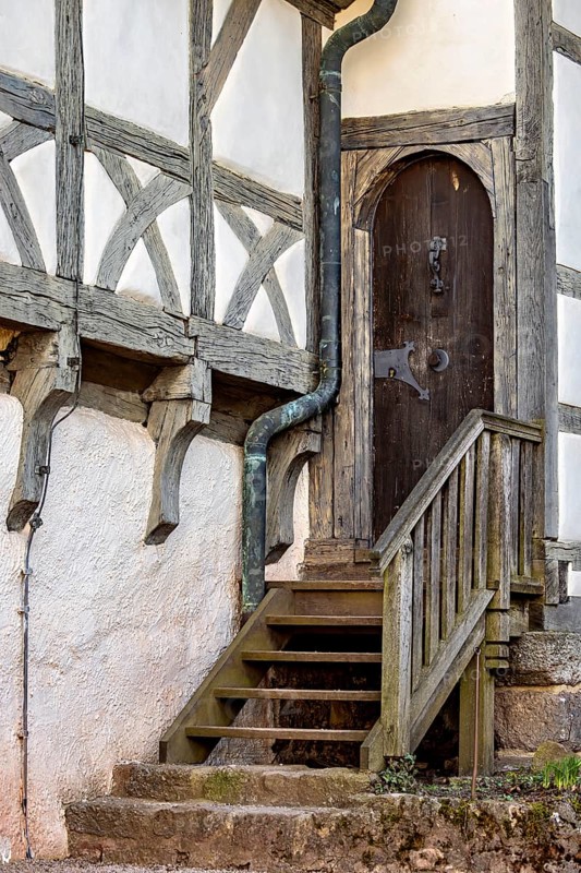 Wooden door with staircase on a rustic half-timbered building, Wartburg Castle near Eisenach in Thuringia