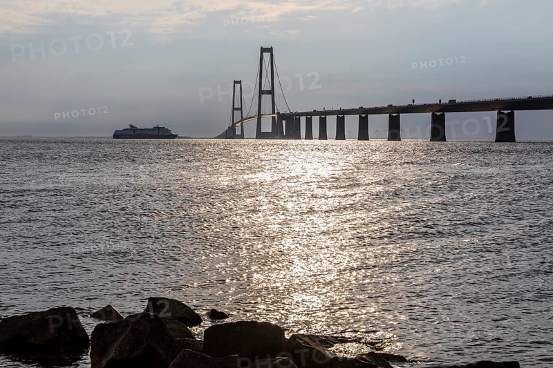 Large Color Line ferry crossing the Storebelt Bridge seen from Halsskov Odde viewpoint, East Bridge, Denmark