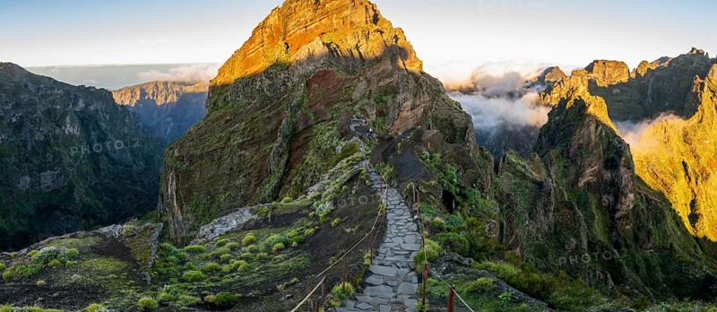 Sunrise at Pico do Arieiro, clouds of fog pass over mountain peaks, hiking trail PR1, Madeira, Portugal