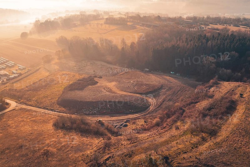 Dawn over a hilly landscape with trees and fields in soft autumn colors, landfill, Gechingen, Calw district, Germany
