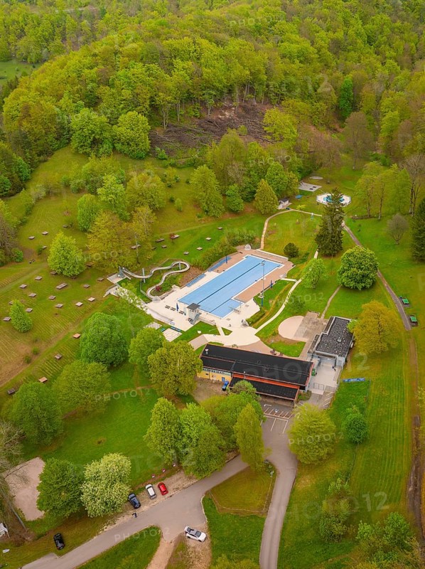 Waldfreibad Eningen unter Achalm, leisure centre with swimming pool surrounded by forest and nature, Eningen, Swabian Alb, Germany