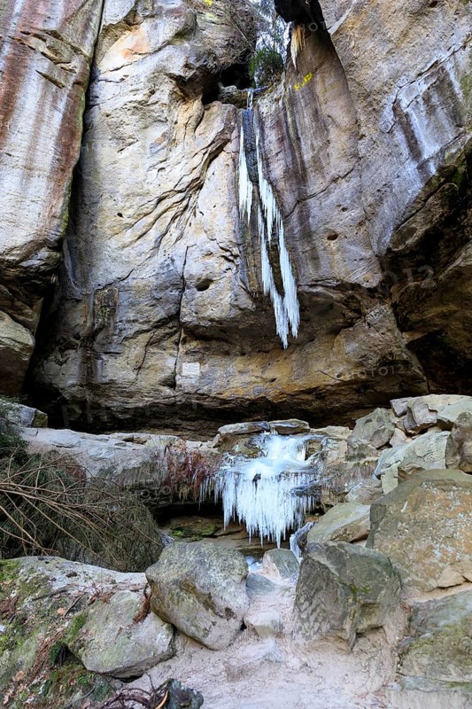 Frozen waterfall with icicles in the Gautschgrotte, Hohnstein, Saxony, Germany