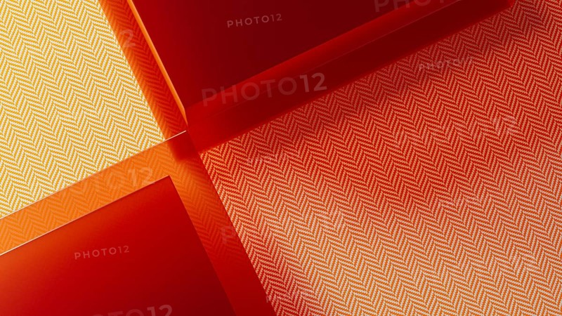 A vibrant abstract background features transparent crystals with a striking red hue and textured patterns, adding depth and intrigue