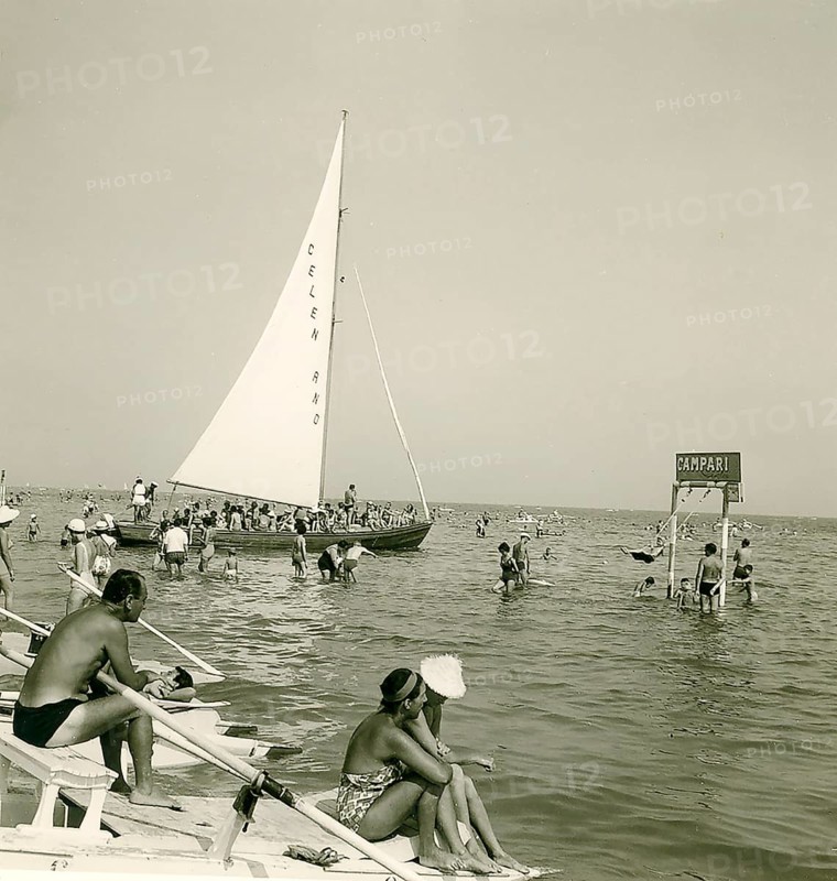 Historical photo summer 1961, tourists, beach, Rimini, Italy