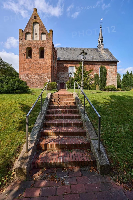 St Martin's Church, Evangelical Lutheran parish of Zetel, brick staircase, metal railings, lawn, trees, Zetel, district of Friesland, Lower Saxony, Germany