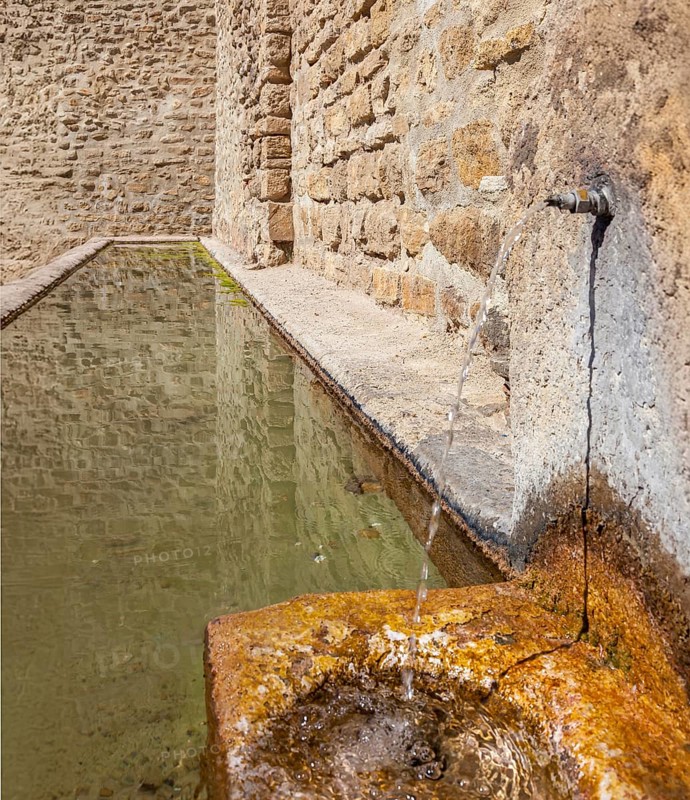 Fountain at the Almocabar city gate, city wall from the 13th century, Ronda, province of Málaga, Andalusia, Spain