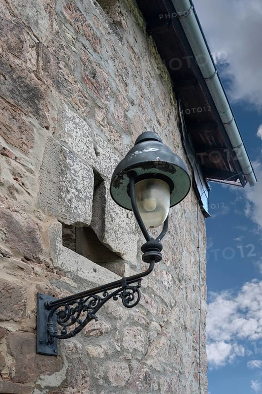 Historic street lamp on an old building, Kulmbach, Upper Franconia, Bavaria, Germany