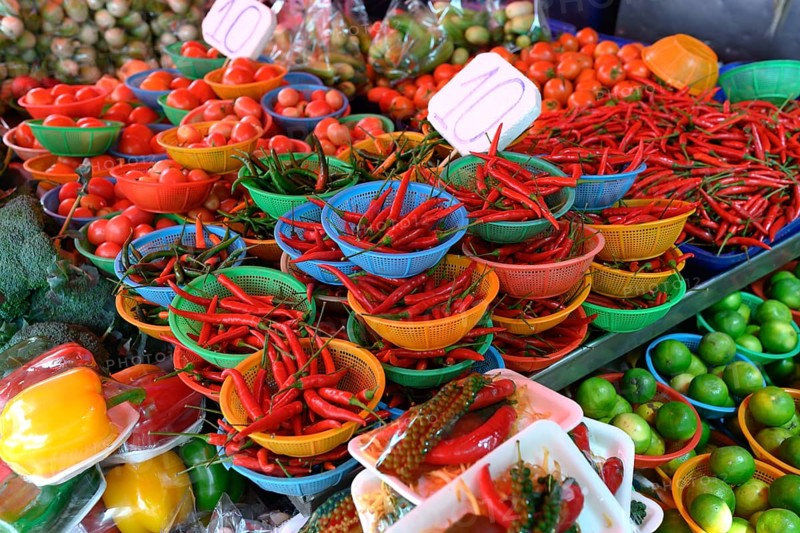 A colourful display of fresh red chilli peppers at Khlong Toei Market, Bangkok