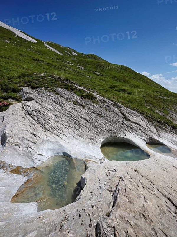 Glacier mill with glacier pots on the Trinser Alp Mora, Trin, Canton Graubünden, Switzerland