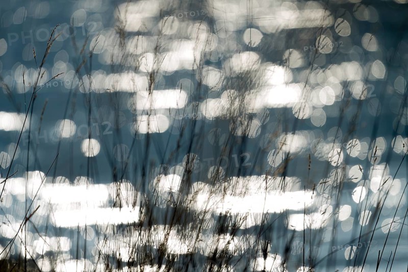 Waves on the Weser river with sun reflexes, Wesertal, Weserbergland, Germany