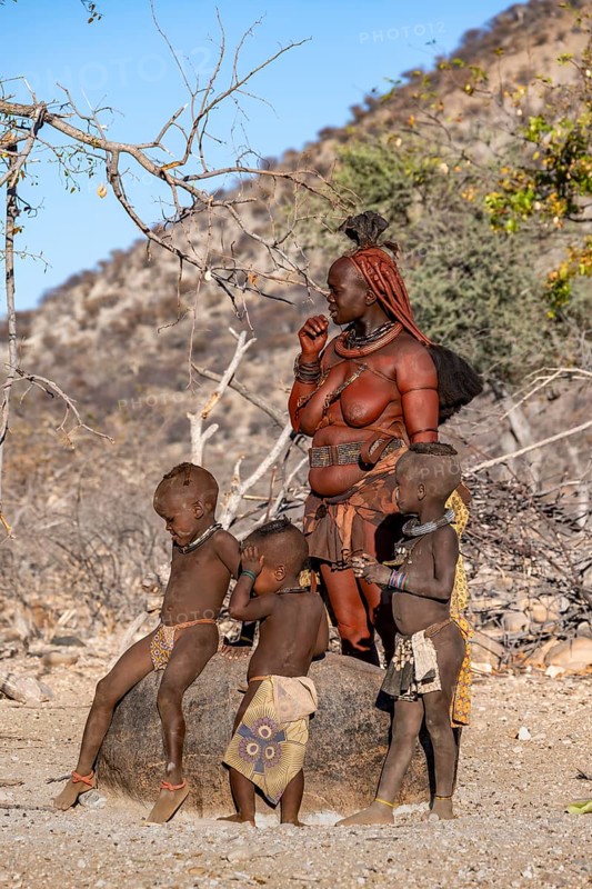 Married Himba woman with children, traditional Himba village, Kaokoveld, Kunene, Namibia