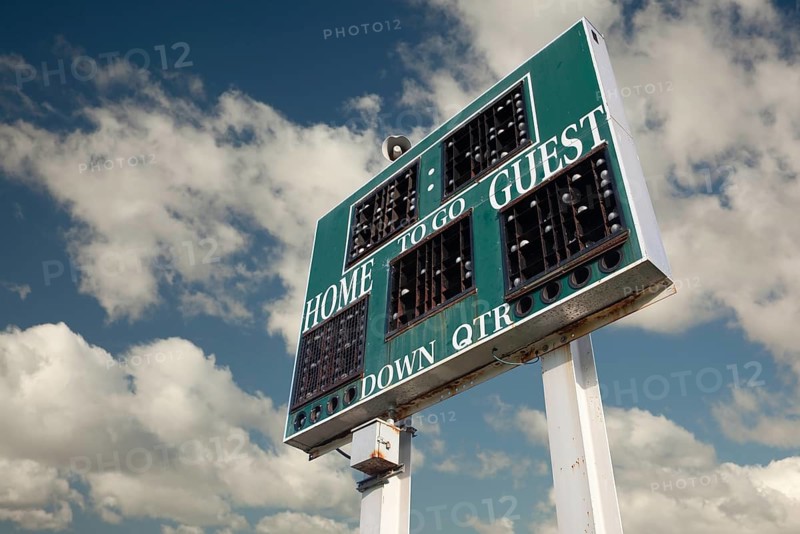 HIgh School Scoreboard with a Beautiful Sky and Clouds Background